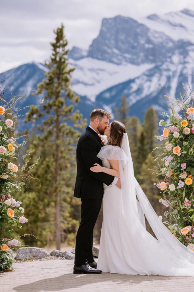 Wedding ceremony floral pillars at Silvertip Resort in Canmore, Alberta, with mountain views
