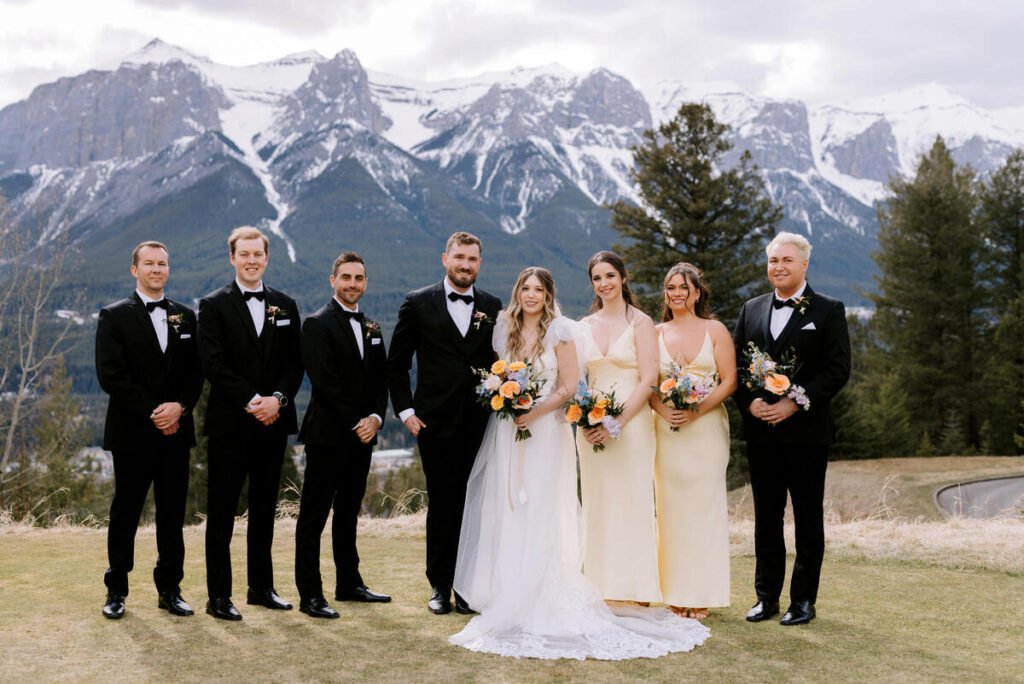 Bridal party with bouquets at a Silvertip Resort wedding in Canmore, Alberta.