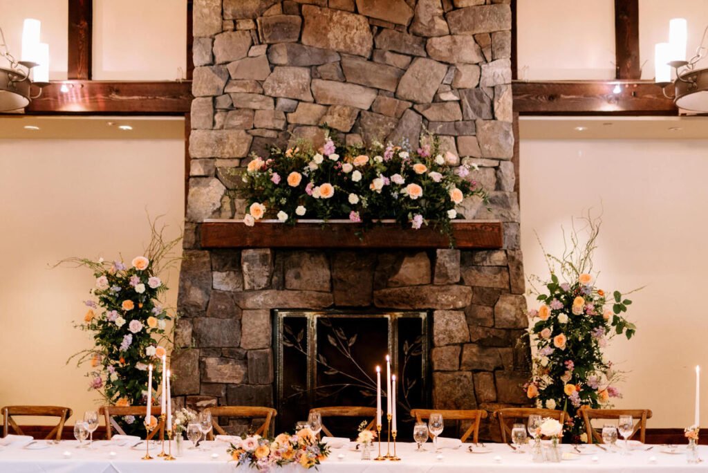 Wedding fireplace floral decor at Silvertip Resort in Canmore, Alberta