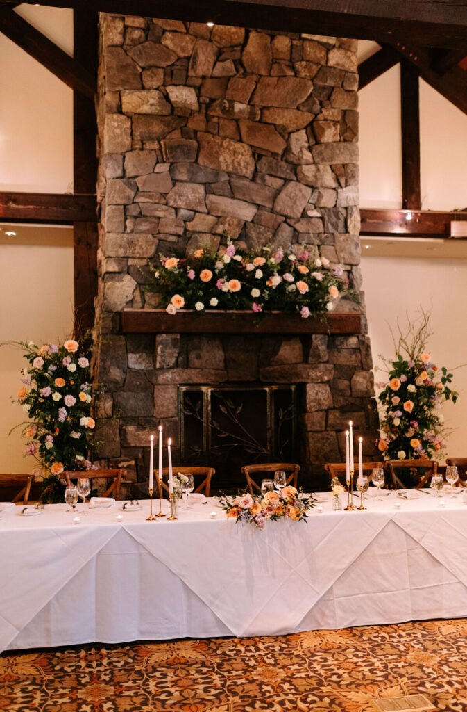 Wedding fireplace floral decor at Silvertip Resort in Canmore, Alberta